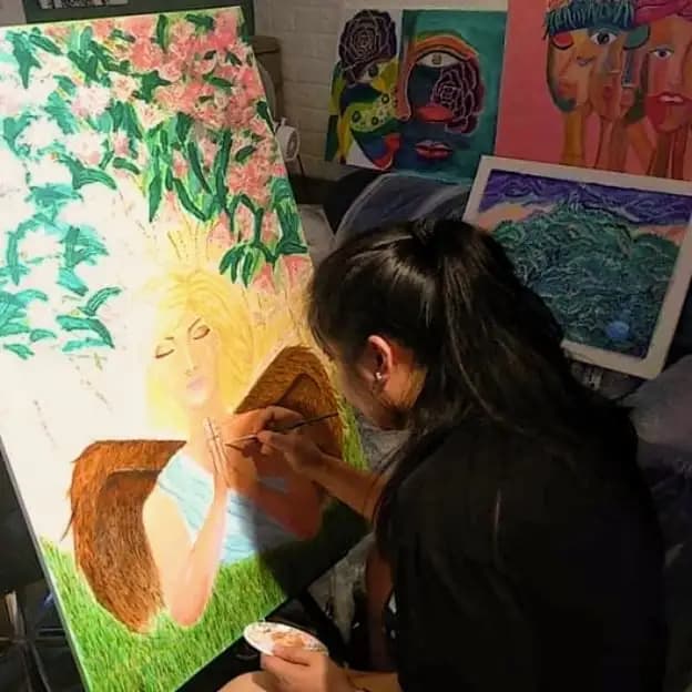 The artist Lehwa Gold creating the painting called Angel